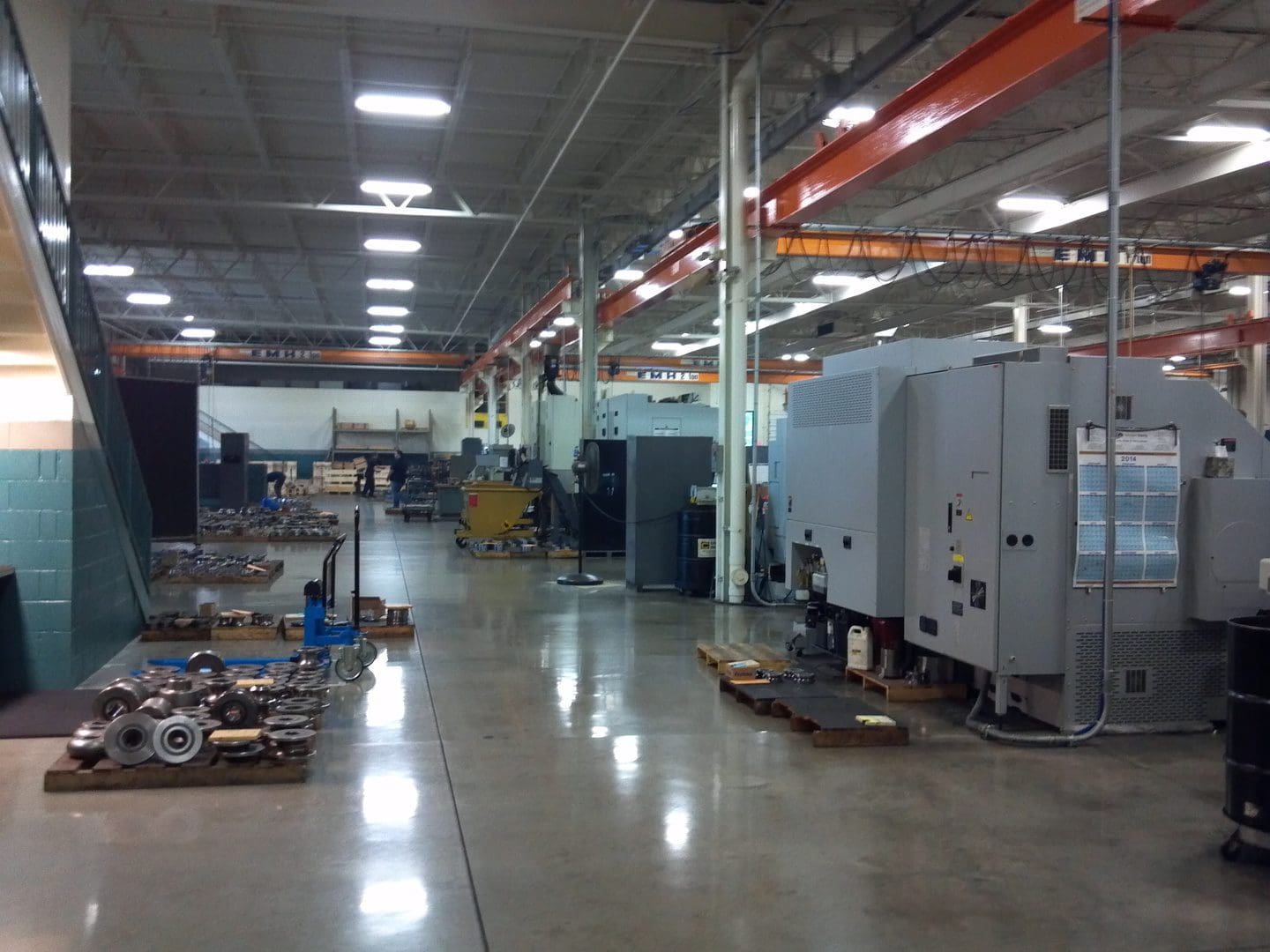 Interior of a clean, organized industrial workshop with machinery and equipment.